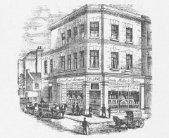 Engraving of a three-story corner shop with the entrance on the corner and the words “Corn & Coal Merchant / T H James / Family Miller & Baker” on the frontage.  A few horse-drawn vehicles are shown in the street, including one with the words “T H James / Family Miller / Croydon”.