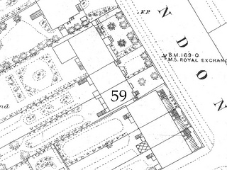 A section of a printed black-and-white line map showing details of houses along one side of a road.  One of them has been marked “59”; this is shown with a front garden including two trees.
