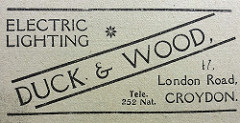 A black-and-white newspaper advert reading: “Electric Lighting / Duck & Wood / 47, London Road, Croydon.”
