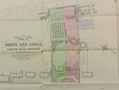 A paper map entitled “Plan of North End Lodge, London Road, Croydon.  To be Sold by Auction on Monday 15th May, 1893.  By Robt W Fuller Moon & Fuller, in conjunction with Hooker & Webb.”  The plan shows three lots, coloured in red, green, and purple; North End Lodge is part of Lot 1 and is noticeably bigger than the surrounding houses.  The grounds (Lots 1 and 2) are also notably extensive.