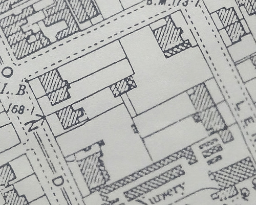A map extract showing a small built-up area, with buildings indicated by diagonal shading.