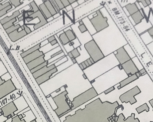 A map extract showing a small built-up area, with buildings indicated by solid shading.