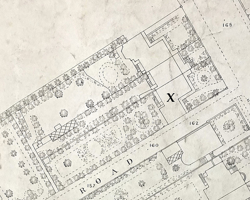 A large-scale map showing houses with gardens.  One of the houses is marked with an “X”.