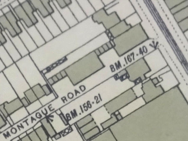 A small section of a printed map, showing the same area as the previous.  The southernmost of the three houses has been extended forward to the pavement line, and more buildings have been constructed behind it, fronting on Montague Road.