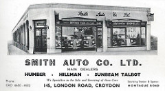 A black and white advert with a drawing of a car showroom at the top.  The showroom is located on a corner, and the entrance door is at a cut-off corner of the building.  Below is printed: “Smith Auto Co. Ltd. / Humber / Hillman / Sunbeam Talbot / We Specialize in the Sale and Servicing of these Cars / 145 London Road, Croydon / Servicing Station & Spares: Montague Road”.
