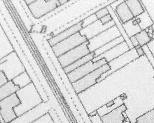 Another monochrome map excerpt; in this, the three houses shown in the previous image have been split and extended forwards.  Echoes of their previous shapes can be seen at the backs.
