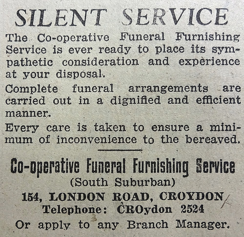 Monochrome text-only advert headed “Silent Service”, stating that “Complete funeral arrangements are carried out in a dignified and efficient manner” and “Every care is taken to ensure a minimum of inconvenience to the bereaved.”  At the bottom is the address of the “Co-operative Funeral Furnishing Service (South Suburban)” at 154 London Road, Croydon.