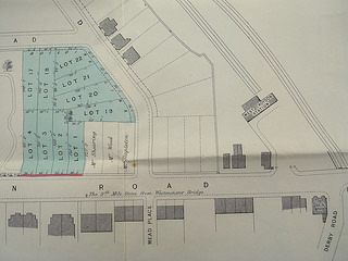 A street plan showing London Road and Oakfield Road, with several building plots marked in green.  The plot on the corner of these two roads is not marked green, and has the name “Mr Stapleton” printed across it.