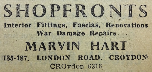 A black-and-white text-only advert reading: “Shopfronts / Internal Fittings, Fascias, Renovations / War Damage Repairs / Marvin Hart / 185–187 London Road, Croydon”.