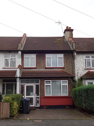 A small terraced house with modern PVC windows (which clearly post-date the house by some time).